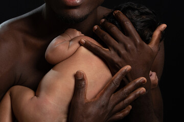daddy with black skin hold and carry baby in his arms and spend love to his interracial daughther