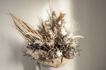 A bouquet of dried flowers as a detail of home interior design close up.