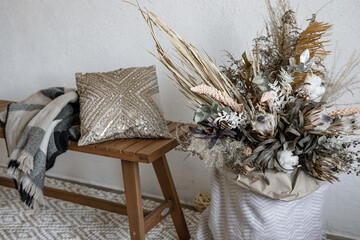 A bouquet of dried flowers as a detail of home interior design close up.