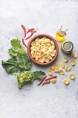 Italian handmade pasta Orecchiette with turnip leaves and tops or cima di rapa with salt anchovies,...