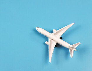 flat lay of airplane model on blue background.