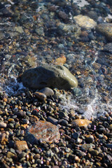 large stone and sea waves.