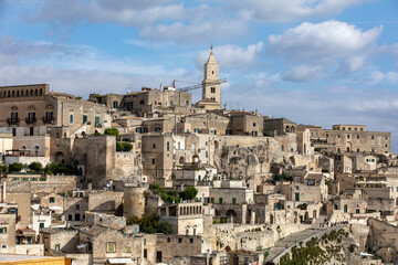 Obraz premium View of the Sassi di Matera a historic district in the city of Matera, well-known for their ancient cave dwellings. Basilicata. Italy