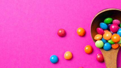 multicolored candy set with a wooden spoon