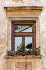 Fototapeta na wymiar Old window in an ancient building in Lviv, Ukraine.