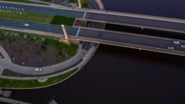 Aerial hyperlapse of Commonwealth Bridge on Lake Burley Griffin during a beautiful sunset in Canberra, the capital of Australia 