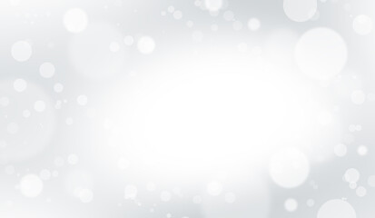 Defocused white lights on a gray background. Abstract bokeh on a white background.