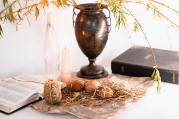 candles, paited eggs, willow branches and bible. easter at home
