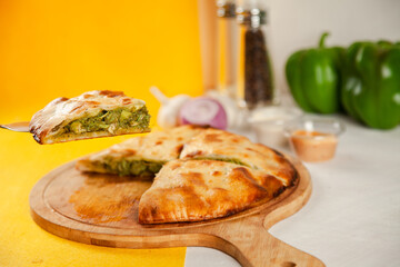 Green chicken tikka stuffed naan cooked in a wood fired oven, food fusion.
