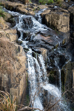a black and brown rocky waterfalls