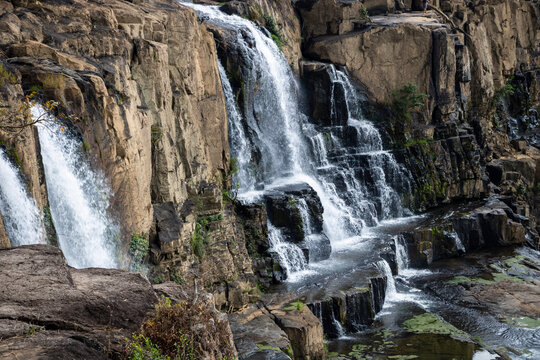 a black and brown rocky waterfalls