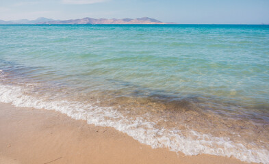 Tigaki beach, Kos, Greece. Beautiful sandy beach with clear blue water on a sunny day. Dodecanese islands, Aegean Sea