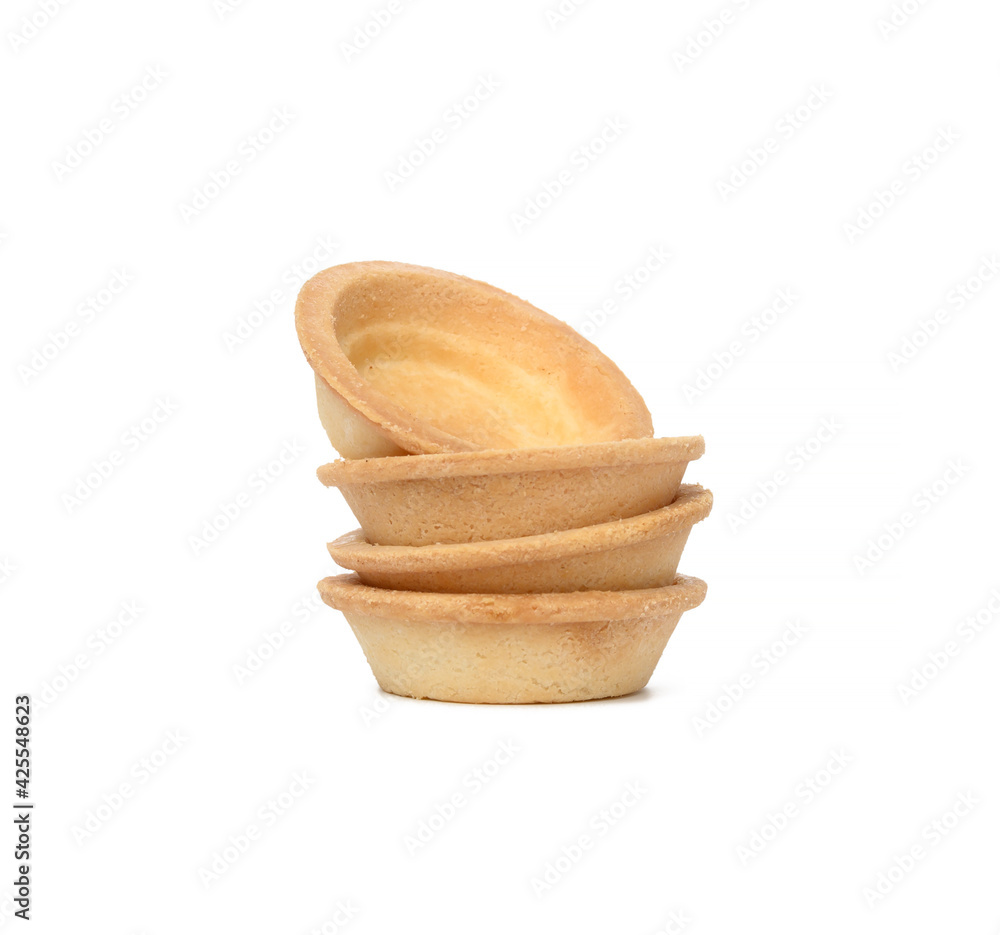 Poster stack of empty baked round canape baskets isolated on white background