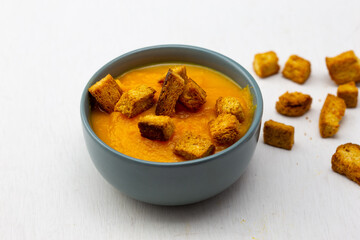 Pumpkin soup served with croutons