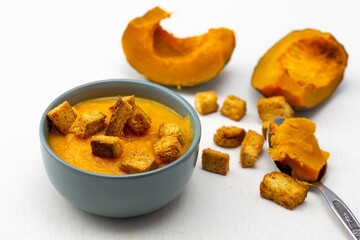 Pumpkin soup served with croutons
