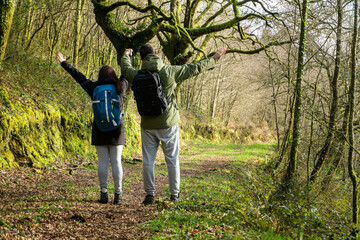 Fototapeta premium Happy couple walking in the woods. Lifestyle concept, outdoors, hike.