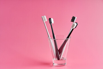 Fashionable toothbrush with soft bristles. Popular toothbrushes. Hygiene trends. Kit of...