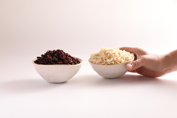 Organic boiled brown rice on bowl isolated in white background