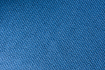 Fototapeta na wymiar Closeup view of a blue waffle fabric as background