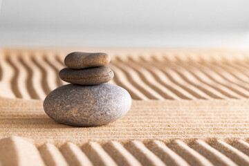 Japanese zen garden with stone in raked sand