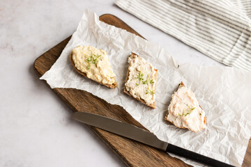 variation of spreads on sourdough rye bread with cress
