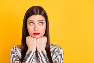 Photo of young girl unhappy sad upset offended depressed failure look empty space isolated over yellow color background