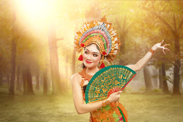 Asian woman dancing Balinese traditional dance (Kembang Girang dance)