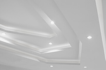 White ceiling with lights and bulbs details Decorated in white and beautiful angled.
