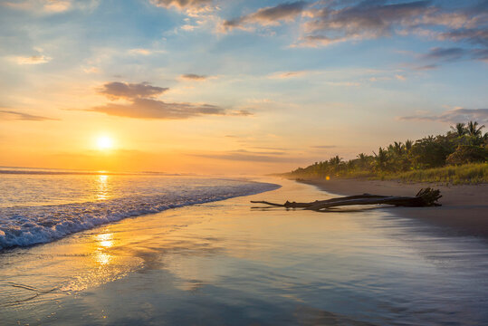 Beautiful sunset sky on the beach in Matapalo, Costa Rica. Central America. Sky background on sunset. Tropical sea.