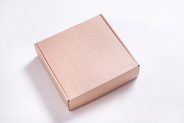 Brown cardboard flat box on white background