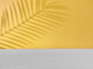 Yellow-gray background for product presentation with natural shadows