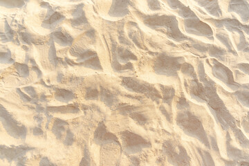 Sand on the beach for background. Brown beach sand texture as background.