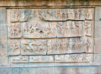 Bas relief ancient sculptures carved on the walls of historical Brihadeeswarar temple in Thanjavur, Tamilnadu. Indian rock art relief carvings of ancient God sculptures in temple walls in Tamilnadu.