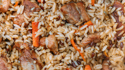Close-up view of Asian pilaf food background. Traditional Eastern culinary dish. 