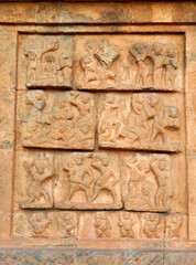 Bas relief ancient sculptures carved on the walls of historical Brihadeeswarar temple in Thanjavur, Tamilnadu. Indian rock art relief carvings of ancient God sculptures in temple walls in Tamilnadu.