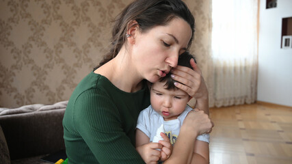 Mom hugs her little son. Love of family concept