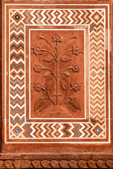 Beautiful flower carved in red stone, Fatehpur Sikri, India