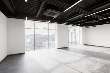 Interior photography, large spacious office center, with panoramic windows and unfurnished glass doors