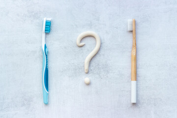 Bamboo toothbrush with toothpaste, overhead view.Dental hygiene concept