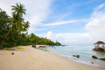 Nature landscape of sea beach turquoise water against blue sky with cloud