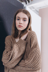 Portrait of young emotional blond caucasian girl in studio on background. Natural beauty, no make up concept