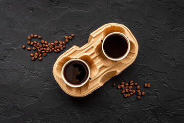 Paper coffee cups with coffee beans. Top view