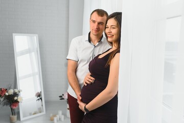 profile shot of pregnant wife and husband