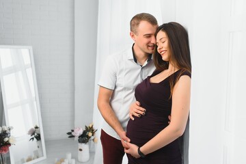 profile shot of pregnant wife and husband