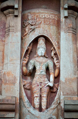 Fototapeta na wymiar Statues of Hindu God. Sculptures of God idols carved in the walls of ancient Brihadeeswarar temple in Thanjavur, Tamilnadu.