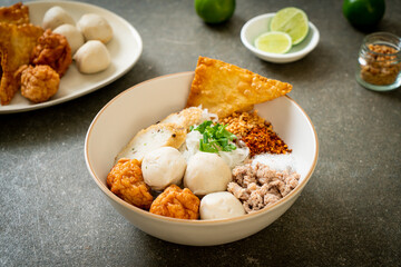 spicy small flat rice noodles with fish balls and shrimp balls without soup