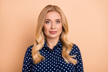 Portrait of attractive content wavy-haired woman skilled specialist wearing formal clothes isolated over beige pastel color background