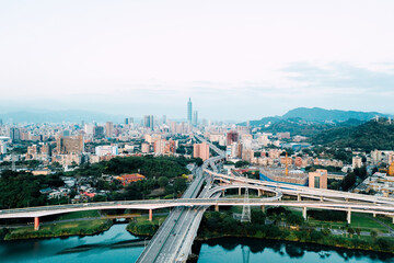 Obraz premium Taipei City Aerial View - Asia business concept image, panoramic modern cityscape building bird’s eye view under sunrise and morning blue bright sky, shot in Taipei, Taiwan