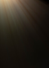 
flare of light on a black background. abstract spotlight background