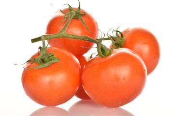 Several ripe, bright red, organic, tasty cocktail tomatoes, close-up, on a white background.